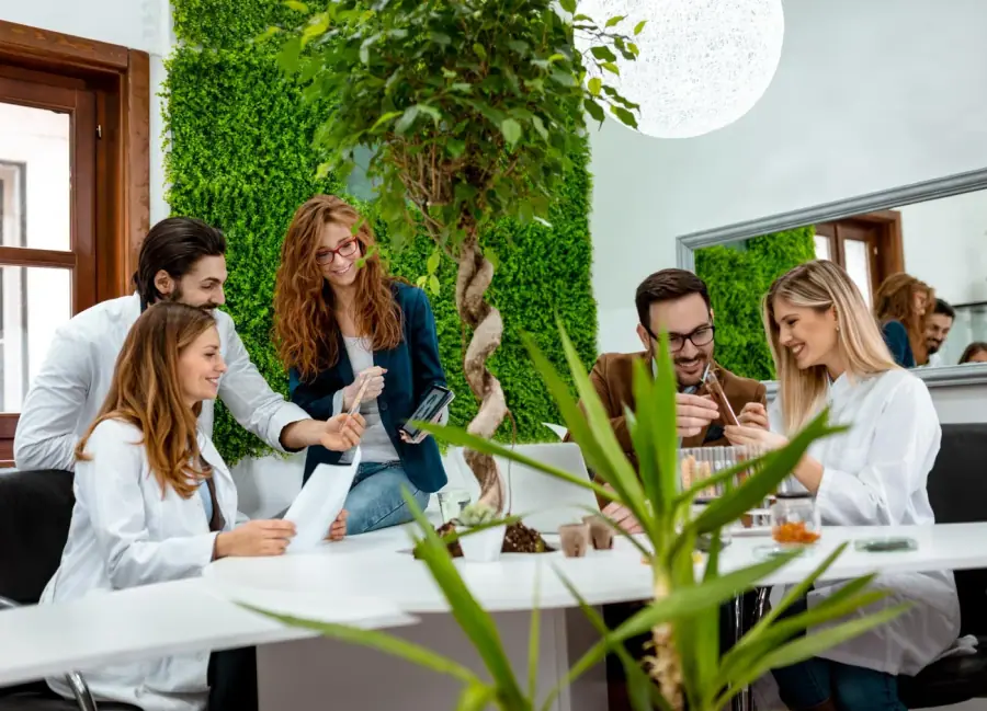 The Brandtropic team reviewing work together